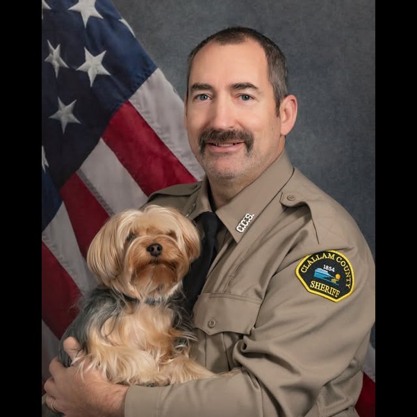 A small logo depicting the news story JAIL STAFFING SHORTAGE FORCES ANIMAL CONTROL DEPUTY REASSIGNMENT